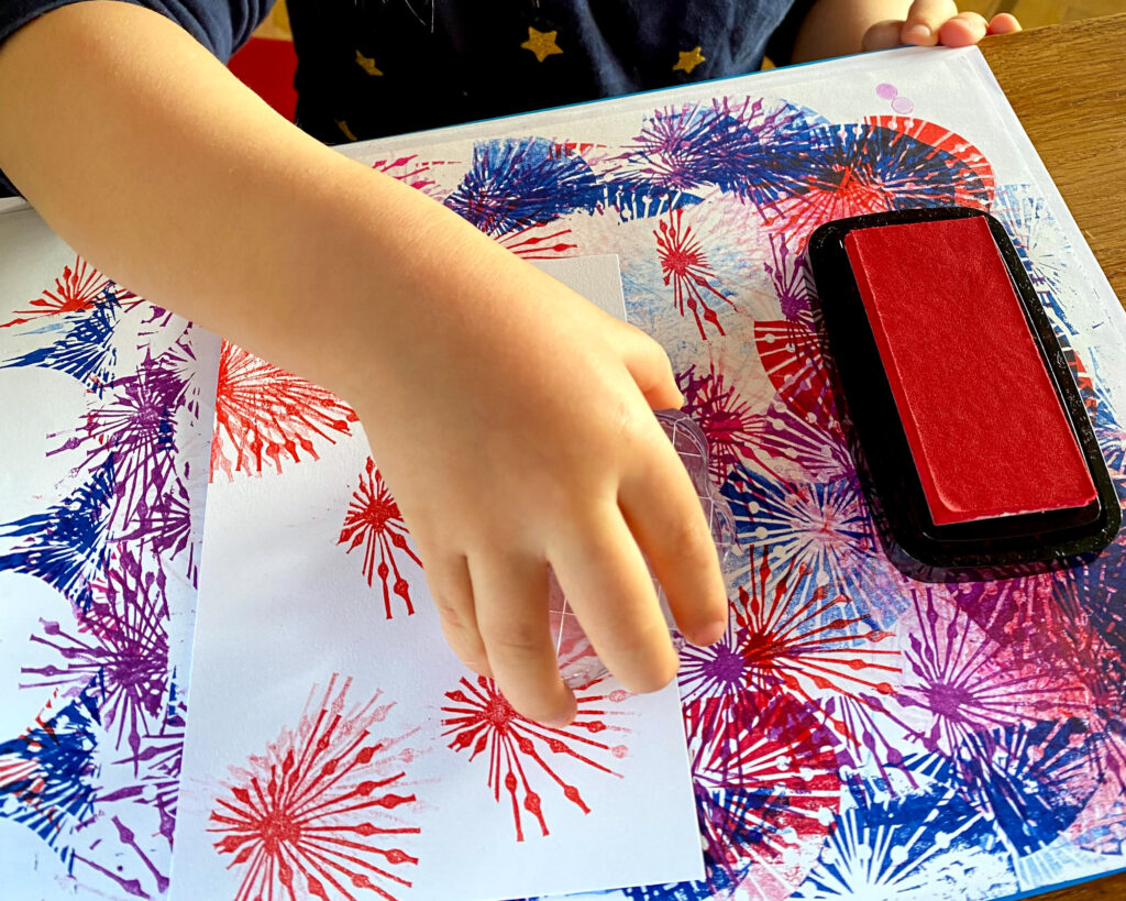 a child printing with a block